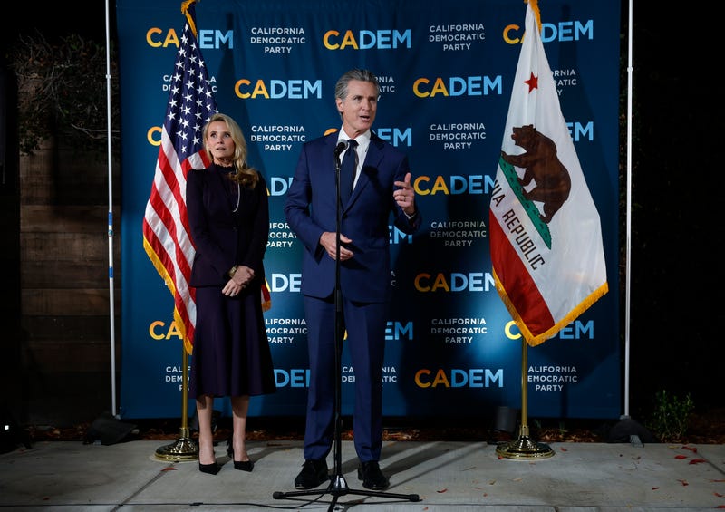 California Gov. Gavin Newsom (R) speaks as his wife Jennifer Siebel Newsom (L) looks on during an election night gathering at the California Democrats headquarters on November 04, 2025 in Sacramento, California. 