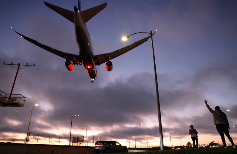 plane overhead at dusk