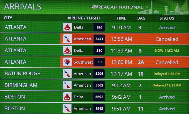 Flight cancellations are shown on a bulletin board at Ronald Reagan Washington National Airport on November 11, 2025 in Arlington, Virginia. 