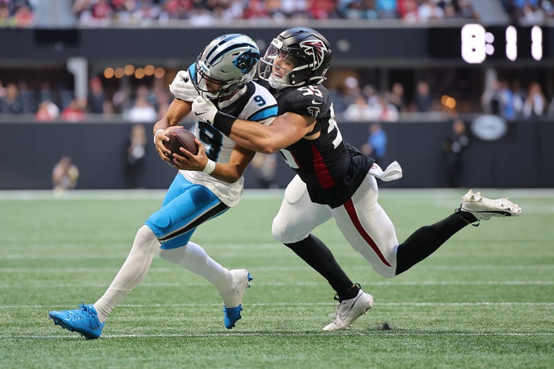ATLANTA, GEORGIA - NOVEMBER 16: Bryce Young #9 of the Carolina Panthers is tackled by Kaden Elliss #55 of the Atlanta Falcons during the third quarter at Mercedes-Benz Stadium on November 16, 2025 in Atlanta, Georgia
