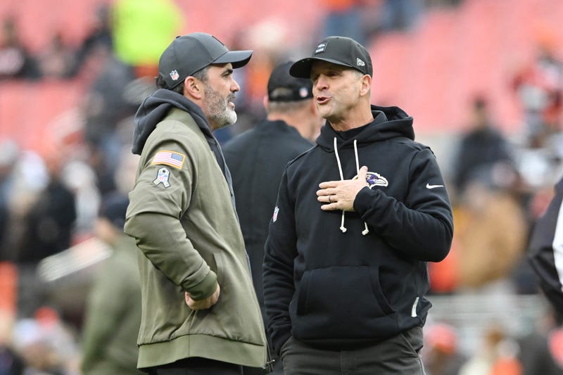 Head coach Kevin Stefanski of the Cleveland Browns speaks with head coach John Harbaugh of the Baltimore Ravens during warmups before the game at Huntington Bank Field on November 16, 2025 in Cleveland, Ohio.