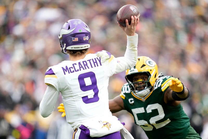 Rashan Gary #52 of the Green Bay Packers pressures J.J. McCarthy #9 of the Minnesota Vikings during the second half at Lambeau Field on November 23, 2025 in Green Bay, Wisconsin. The pass from J.J. McCarthy was intercepted by Green Bay. 