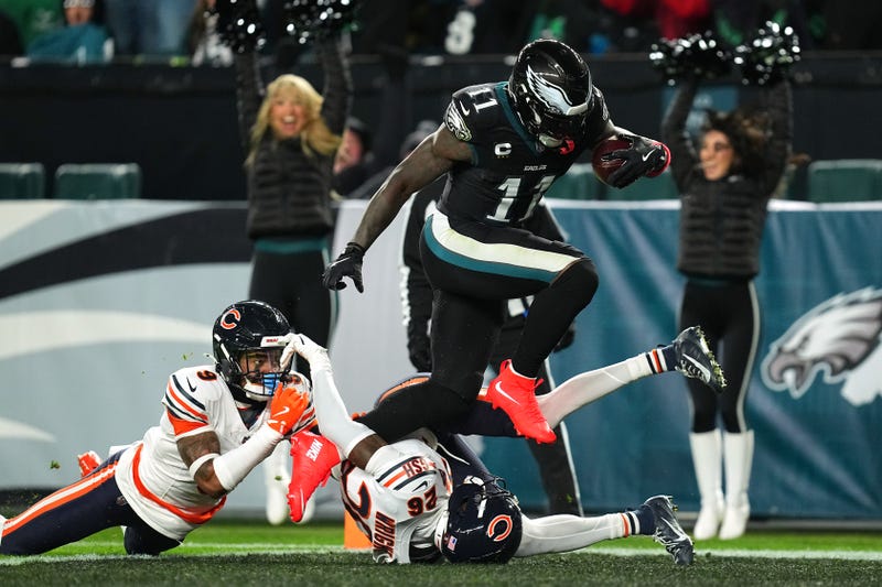A.J. Brown #11 of the Philadelphia Eagles scores a 33 yard touchdown against Jaquan Brisker #9 and Nahshon Wright #26 of the Chicago Bears during the third quarter in the game at Lincoln Financial Field