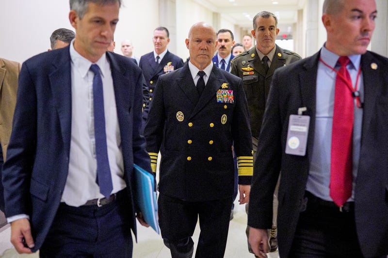 Navy Adm. Frank Bradley (C) arrives for a closed door classified meeting with lawmakers on Capitol Hill on December 4, 2025 in Washington, DC. Members of the Senate and House Armed Services committees meet with Bradley about the strikes on suspected drug boats out of Venezuela ordered by the Trump Administration