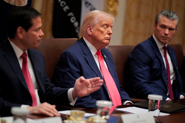  U.S. Secretary of State Marco Rubio (L) speaks as U.S. President Donald Trump and U.S. Secretary of War Pete Hegseth look on during a Cabinet meeting in the Cabinet Room of the White House on December 02, 2025 in Washington, DC. A bipartisan Congressional investigation has begun regarding Secretary of War Pete Hegseth's role in ordering U.S. military strikes on small boats in the waters off Venezuela that have killed scores of people, which Hegseth said are intended "to stop lethal drugs, destroy narco-boats and kill the narco-terrorists who are poisoning the American people.” (Photo by Chip Somodevilla/Getty Images)