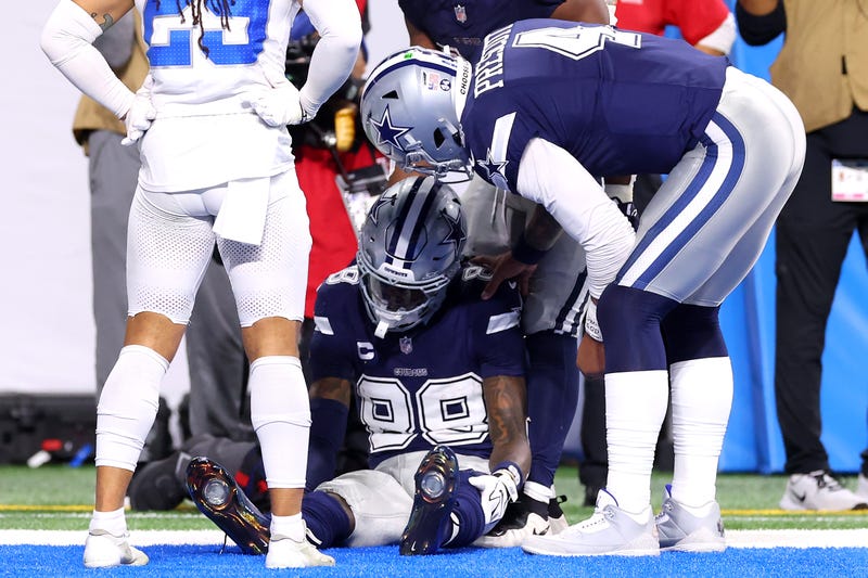 DETROIT, MICHIGAN - DECEMBER 04: Dak Prescott #4 checks on CeeDee Lamb #88 of the Dallas Cowboys after he dropped a ball in the end zone and left the game against the Detroit Lions during the third quarter at Ford Field on December 04, 2025 in Detroit, Michigan. (Photo by Gregory Shamus/Getty Images)