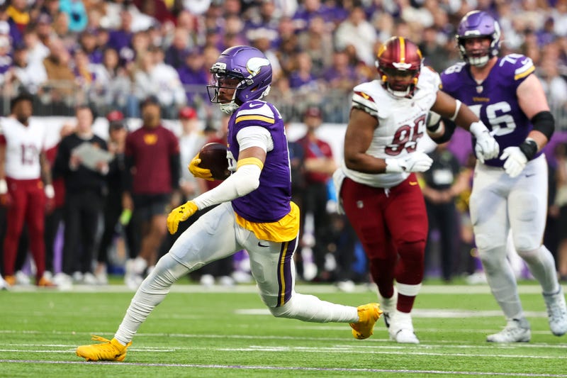 Justin Jefferson #18 of the Minnesota Vikings runs with the ball during the first half against the Washington Commanders at U.S. Bank Stadium on December 07, 2025 in Minneapolis, Minnesota. 