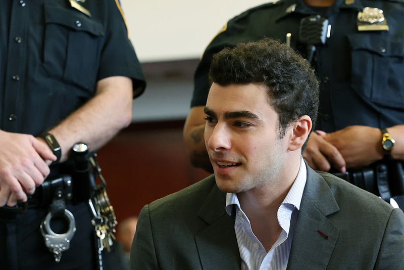 Luigi Mangione appears with his lawyers for a hearing in the killing of UnitedHealthcare CEO Brian Thompson in Manhattan Criminal Court on December 11, 2025 in New York City. 