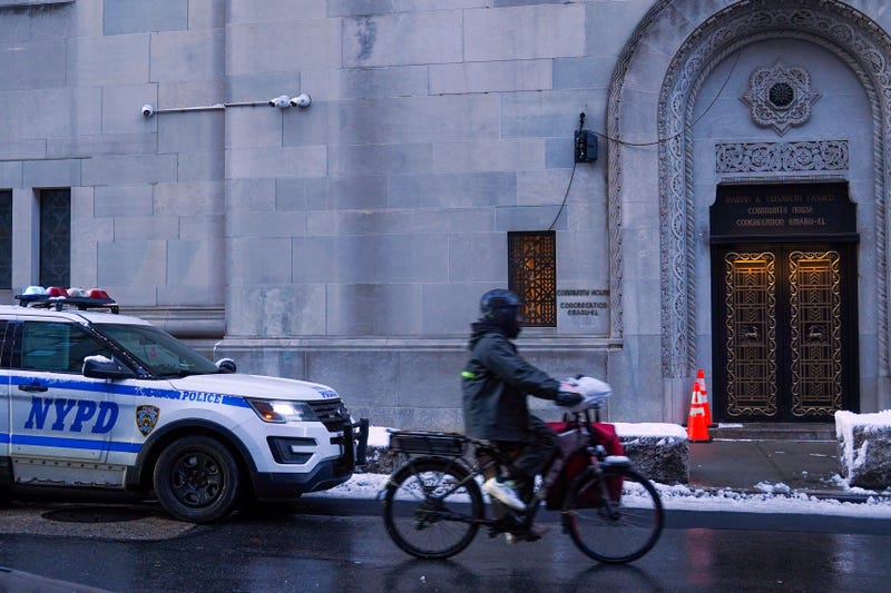 NYPD vehicle is seen outside of the Congregation Temple Emanu-El, a Jewish synagogue, on Dec. 14, 2025