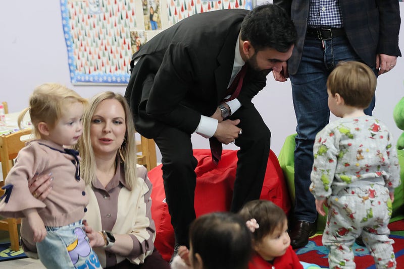 New York City Mayor-elect Zohran Mamdani speaks with a child after reading a Christmas book at Little Scholars on Dec. 11, 2025.