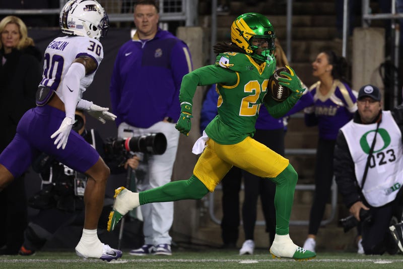 Dierre Hill Jr. #23 of the Oregon Ducks runs for a touchdown during the second quarter against the James Madison Dukes during the 2025 College Football Playoff First Round Game at Autzen Stadium on December 20, 2025 in Eugene, Oregon.