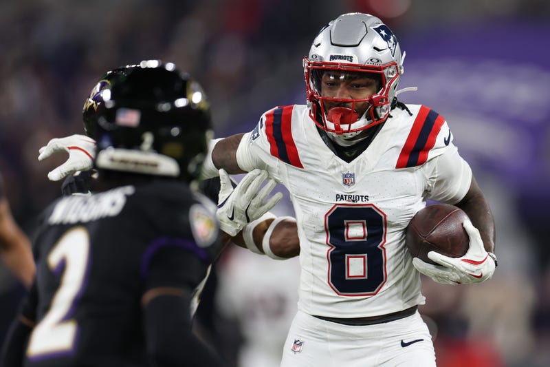 Stefon Diggs #8 of the New England Patriots carries the ball after a reception against the Baltimore Ravens during the second quarter at M&T Bank Stadium on December 21, 2025 in Baltimore, Maryland. 