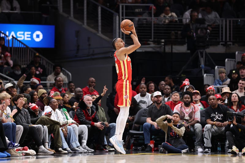 ATLANTA, GEORGIA - DECEMBER 23: Zaccharie Risacher #10 of the Atlanta Hawks shoots a three-point basket against the Chicago Bulls during the fourth quarter at State Farm Arena on December 23, 2025 in Atlanta, Georgia