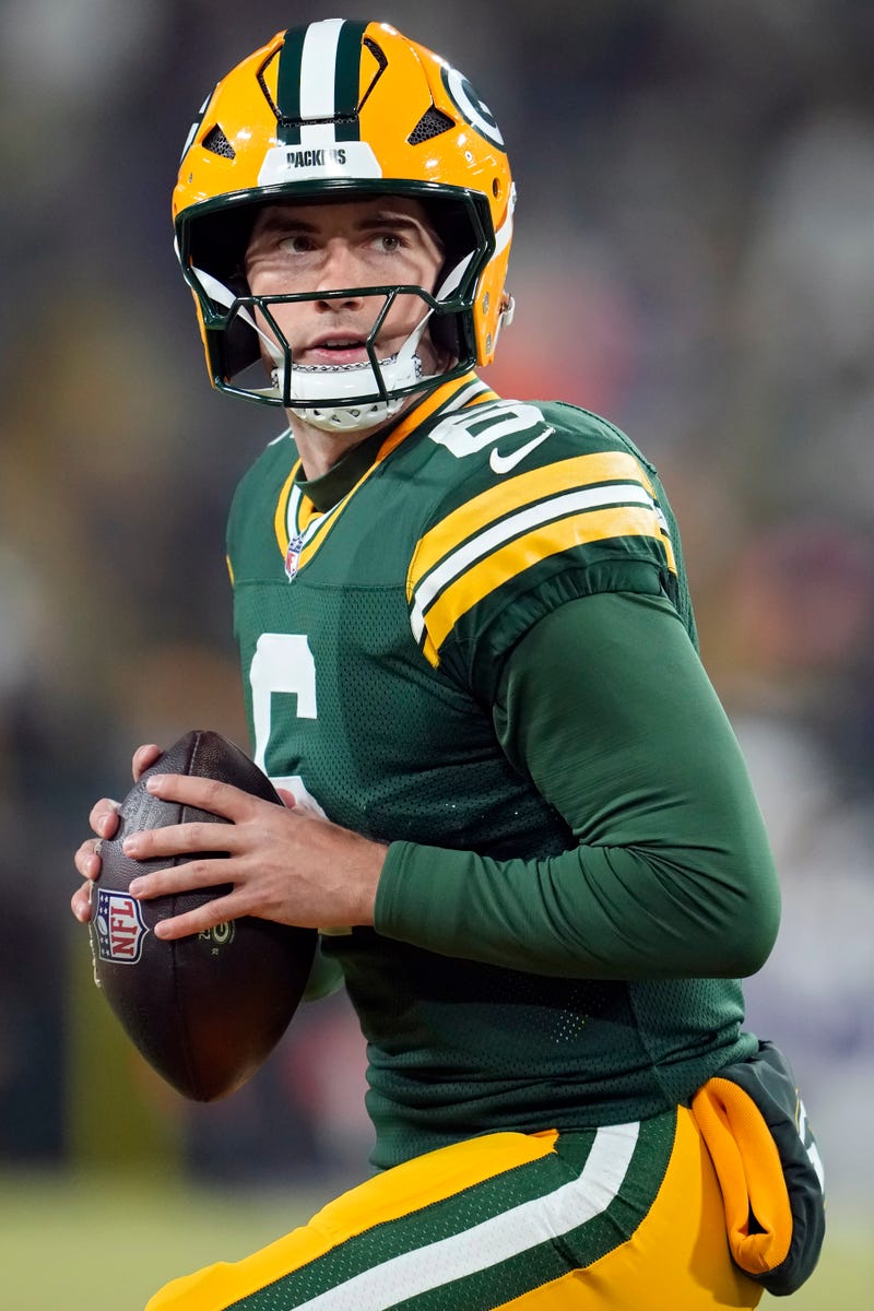 Clayton Tune #6 of the Green Bay Packers warms up before the game against the Baltimore Ravens at Lambeau Field on December 27, 2025 in Green Bay, Wisconsin. 