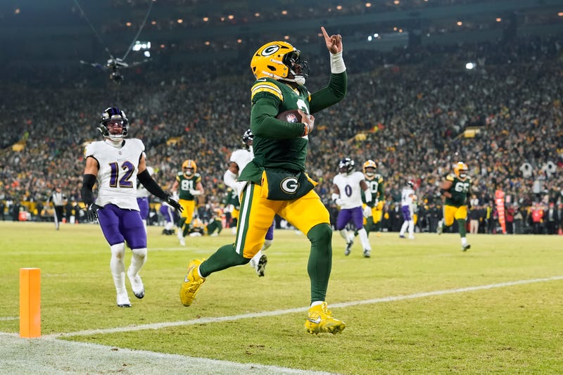 Malik Willis #2 of the Green Bay Packers scores a touchdown in the second quarter against the Baltimore Ravens at Lambeau Field on December 27, 2025 in Green Bay, Wisconsin.