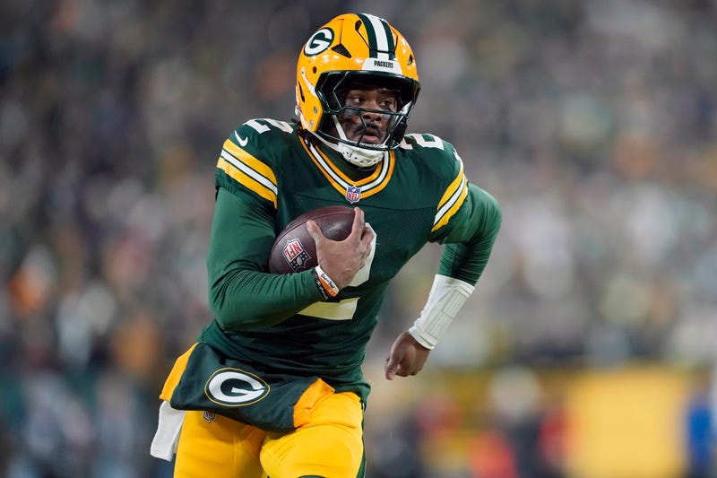 Malik Willis #2 of the Green Bay Packers runs with the ball in the second quarter against the Baltimore Ravens at Lambeau Field on December 27, 2025 in Green Bay, Wisconsin.