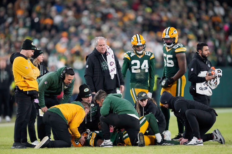 Kamal Hadden #36 of the Green Bay Packers is attended to after being injured in the third quarter against the Baltimore Ravens at Lambeau Field on December 27, 2025 in Green Bay, Wisconsin. 
