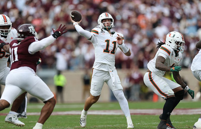 Carson Beck #11 of the Miami Hurricanes throws a pass in the first half against the Texas A&M Aggies during the 2025 College Football Playoff First Round Game at Kyle Field on December 20, 2025 in College Station, Texas. 