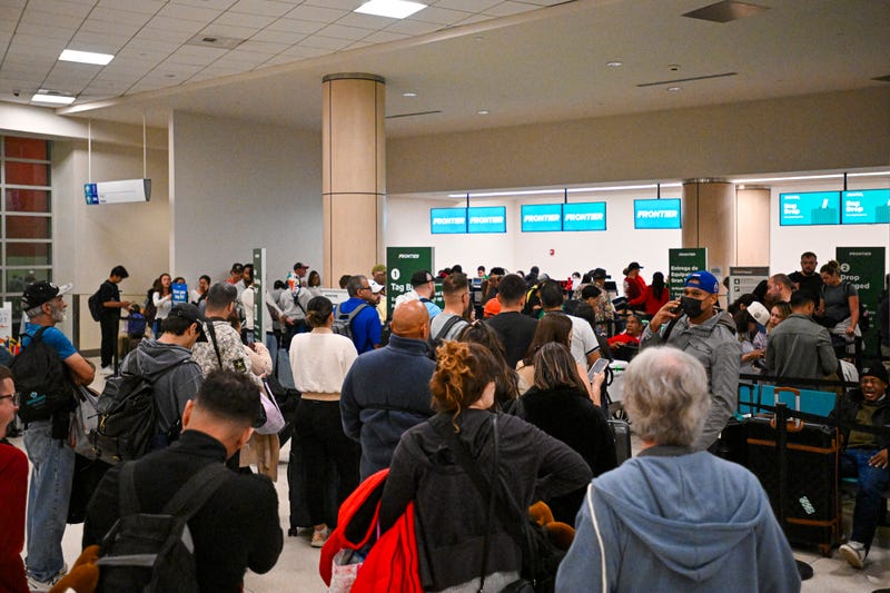 Passengers wait at Luis Munoz Marin International Airport as all flights are cancelled following US military action in Venezuela, on January 3, 2026, in Carolina, Puerto Rico. 
