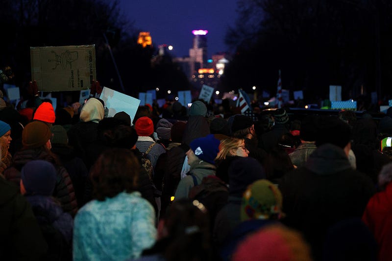 People gather for a vigil following a shooting by an ICE agent during federal law enforcement operations on January 07, 2026 in Minneapolis, Minnesota. 