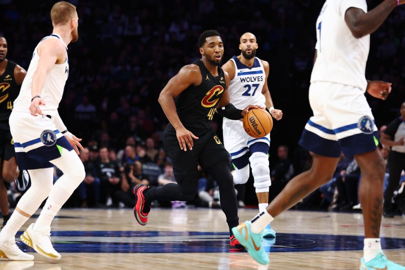  Donovan Mitchell #45 of the Cleveland Cavaliers dribbles the ball through mid-court during the second half against the Minnesota Timberwolves at Target Center on January 08, 2026 in Minneapolis, Minnesota. The Timberwolves beat the Cavaliers 131-122.