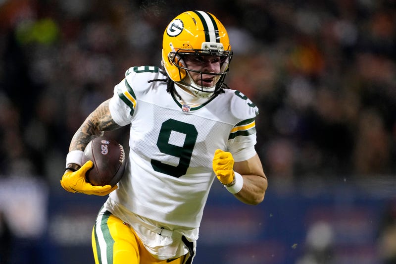  Christian Watson #9 of the Green Bay Packers runs the ball after a catch against the Chicago Bears during the second quarter in the NFC Wild Card Playoff game at Soldier Field on January 10, 2026 in Chicago, Illinois