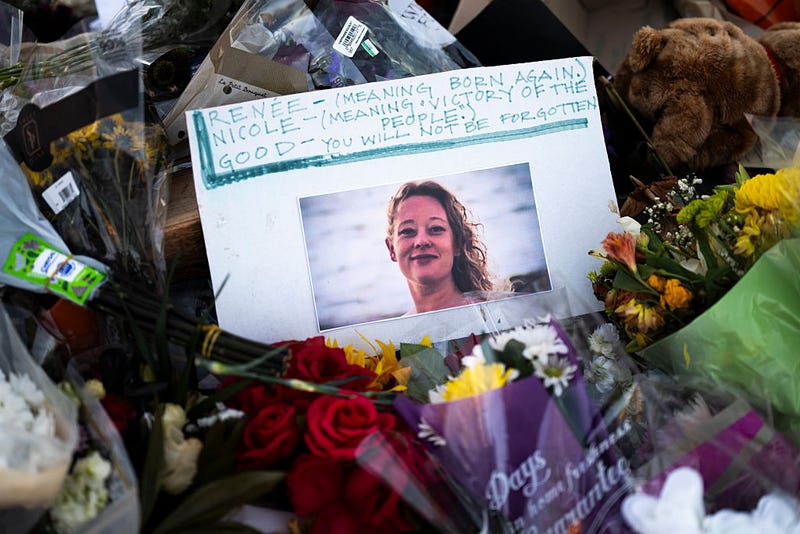 A portrait of Renee Good is placed at a memorial near the site where she was killed a week ago, on January 14, 2026 in Minneapolis, Minnesota. Good was fatally shot by an immigration enforcement agent during an incident in south Minneapolis on January 7.