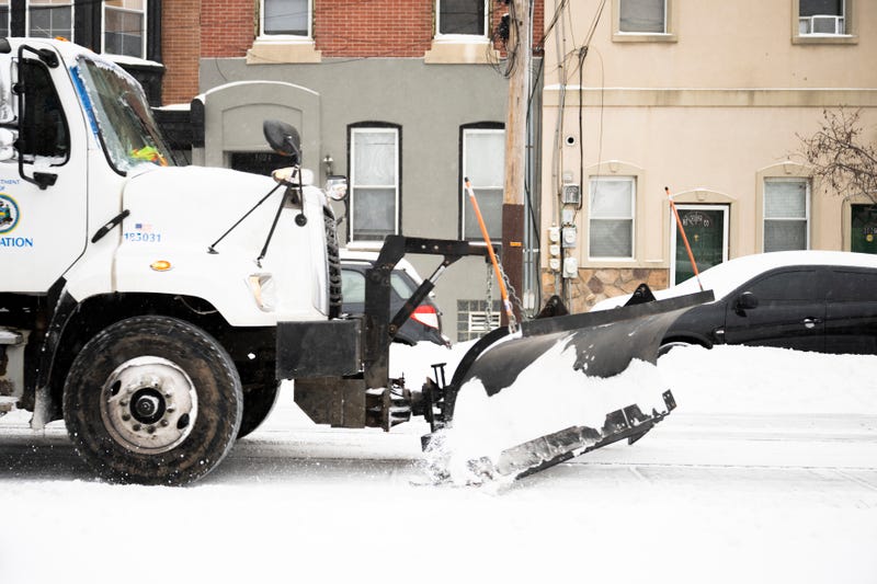 A city snow plow moves snow from a street in Philadelphia during a previous snow storm.