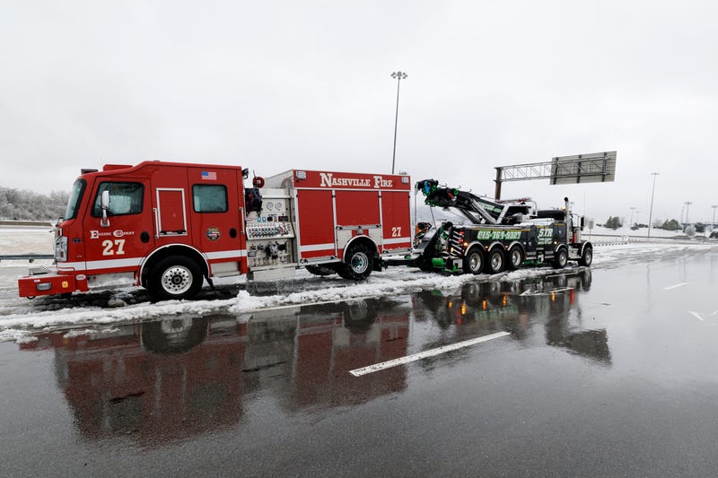 NASHVILLE, TENNESSEE - JANUARY 25: A disabled Nashville Fire Department truck is drained of water as a tow truck prepares to move it on January 25, 2026 in Nashville, Tennessee. A massive winter storm is bringing frigid temperatures, ice, and snow to millions of Americans across the nation. (Photo by Brett Carlsen/Getty Images)