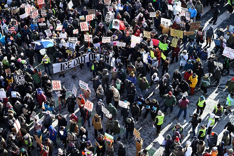 Demonstrators participate in a rally and march during an "ICE Out” day of protest on January 23, 2026 in Minneapolis, Minnesota. 