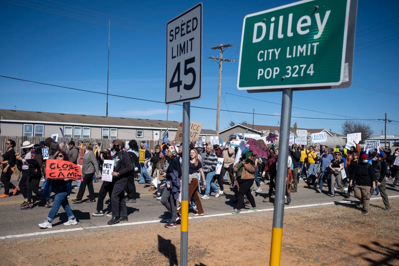 DILLEY, TEXAS - JANUARY 28: People protest against Immigration and Customs Enforcement as they march toward the South Texas Family Residential Center on January 28, 2026 in Dilley, Texas. A federal judge temporarily blocked the deportation of 5-year-old Liam Conejo Ramos and his father, Adrian Conejo Arias, who were arrested in Minneapolis after the father had picked the boy up from school. They were then taken to the South Texas Family Residential Center, an immigration detention center outside San Antonio, where they remain. (Photo by Joel Angel Juarez/Getty Images)