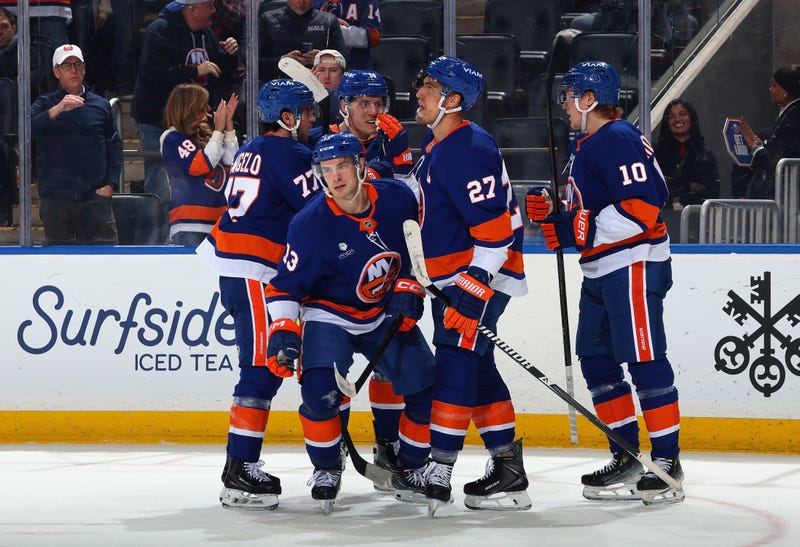 The Islanders celebrate a goal.