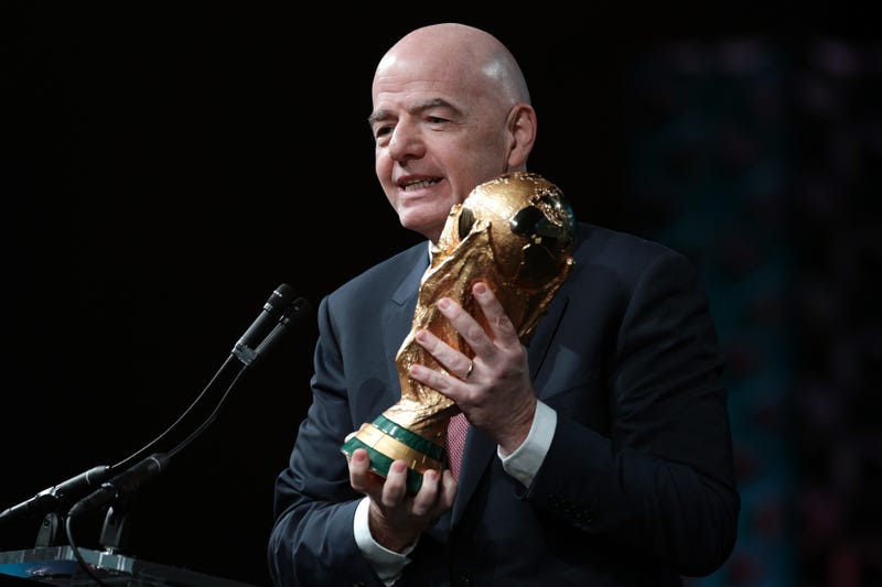 FIFA President Gianni Infantino holds FIFA World Cup Trophy