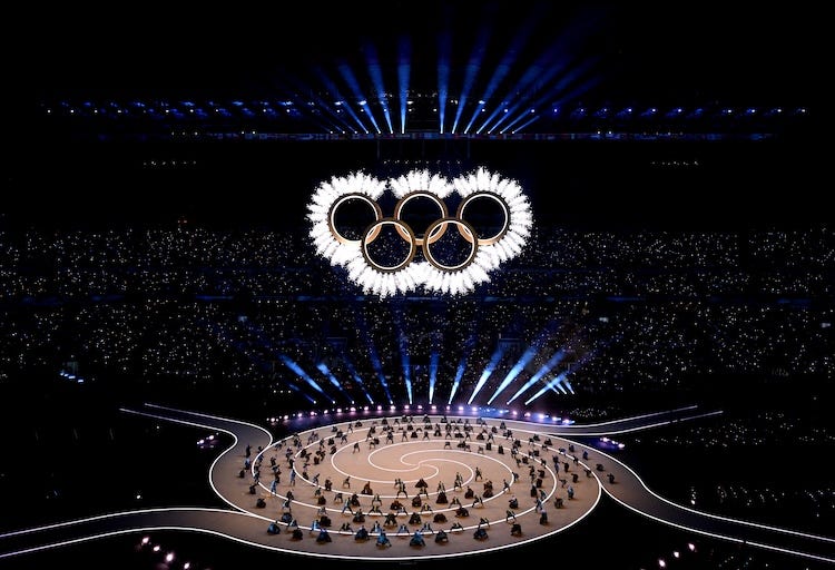 A general view as the Olympic rings come together for a fireworks display during the opening ceremony of the Milano Cortina 2026 Winter Olympics at San Siro Stadium on February 06, 2026 in Milan, Italy.