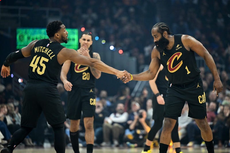 CLEVELAND, OHIO - FEBRUARY 11: Donovan Mitchell #45 and James Harden #1 of the Cleveland Cavaliers celebrate during the first half against the Washington Wizards at Rocket Arena on February 11, 2026 in Cleveland, Ohio.