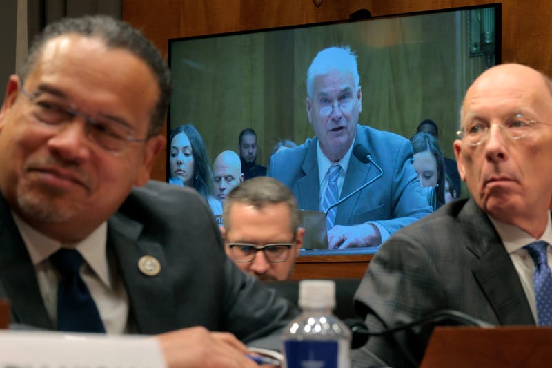 Minnesota Attorney General Keith Ellison (L) and Minnesota Department of Corrections Commissioner Paul Schnell (R) watch as House Majority Whip Tom Emmer (R-MN) testify before the Senate Homeland Security and Governmental Affairs Committee in the Dirksen Senate Office Building on February 12, 2026 in Washington, DC. 