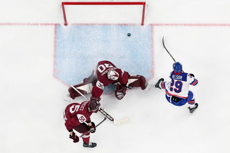 Brock Nelson #29 of Team United States scores a goal against Elvis Merzlikins #30 of Team Latvia in the second period during the Men's Preliminary Group C match between Latvia and United States on day six of the Milano Cortina 2026 Winter Olympic games at Milano Santagiulia Ice Hockey Arena on February 12, 2026 in Milan, Italy. 