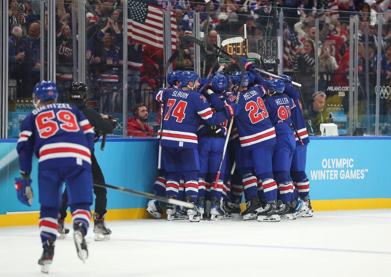 Quinn Hughes #43 of Team United States celebrates with teammates after scoring a goal in overtime during the Men's Quarterfinals Playoff match between the United States and Sweden on day 12 of the Milano Cortina 2026 Winter Olympic games at Milano Santagiulia Ice Hockey Arena on February 18, 2026 in Milan, Italy. 