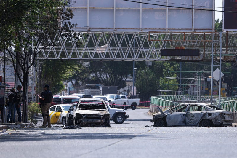 A view of a closed street due to burned vehicles on February 22, 2026 in Zapopan, Mexico. 
