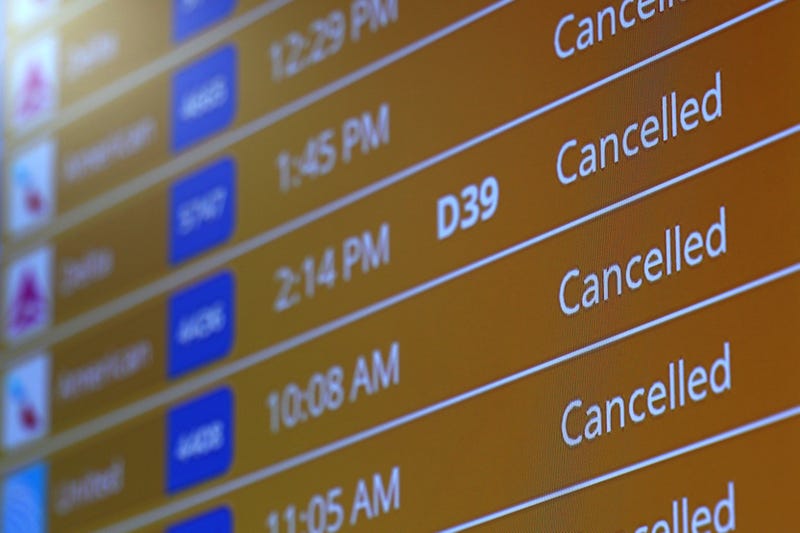 Flight board at the airport showing multiple cancellations 