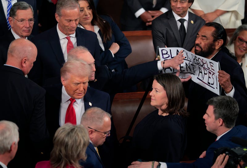 WASHINGTON, DC - FEBRUARY 24: Rep. Al Green (D-TX) holds up a sign as Trump delivers his State of the Union address during a Joint Session of Congress at the U.S. Capitol on February 24, 2026, in Washington, DC. Trump delivered his address days after the Supreme Court struck down the administration's tariff strategy and amid a U.S. military buildup in the Persian Gulf threatening Iran. (Photo by Chip Somodevilla/Getty Images)