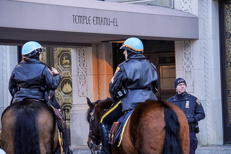 NYPD officers stand guard outside of Temple Emanu-El on Feb. 28, 2026 in New York City. U.S. President Donald Trump announced that the United States and Israel had launched an attack on Iran Saturday morning. 