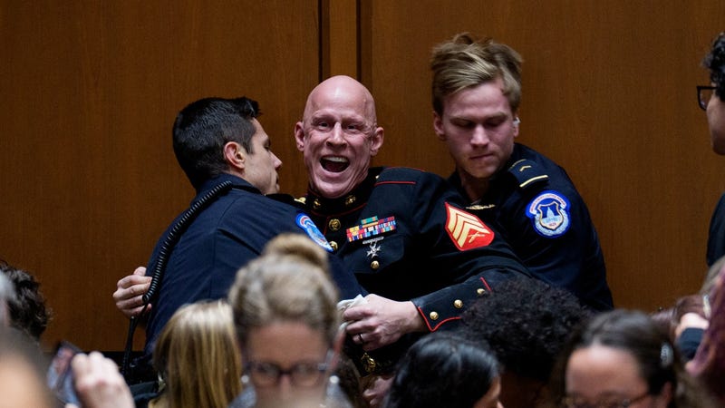 Brian McGinnis, a protester dressed in a military uniform, disrupts a Senate Armed Services Subcommittee hearing on Capitol Hill on March 4, 2026 in Washington, DC.