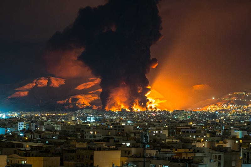 Smoke and flames rise at the site of airstrikes on an oil depot in Tehran on March 7, 2026. The United States and Israel launched strikes against Iran on February 28, prompting Iranian retaliation with missile attacks across the region and intensifying concerns about disruption to global energy and transport. (Photo by Sasan / Middle East Images / AFP via Getty Images)
