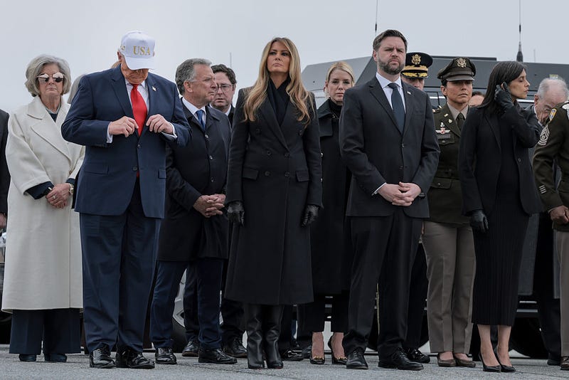 White House Chief of Staff Susie Wiles, U.S. President Donald Trump, U.S. Special Envoy to the Middle East Steve Witkoff, first lady Melania Trump, U.S. Attorney General Pam Bondi, Vice President JD Vance, and second lady of the United States Usha Vance wait as U.S. Army carry teams prepare to move flag-draped transfer cases at Dover Air Force Base March 07, 2026 in Dover, Delaware