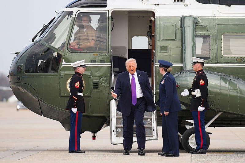 President Donald Trump steps down from Marine One to board Air Force One on March 11, 2026 at Joint Base Andrews, Maryland.