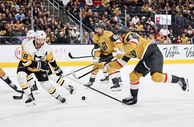 LAS VEGAS, NEVADA - MARCH 12: Kris Letang #58 of the Pittsburgh Penguins blocks a shot by Jack Eichel #9 of the Vegas Golden Knights in the second period of their game at T-Mobile Arena on March 12, 2026 in Las Vegas, Nevada. 