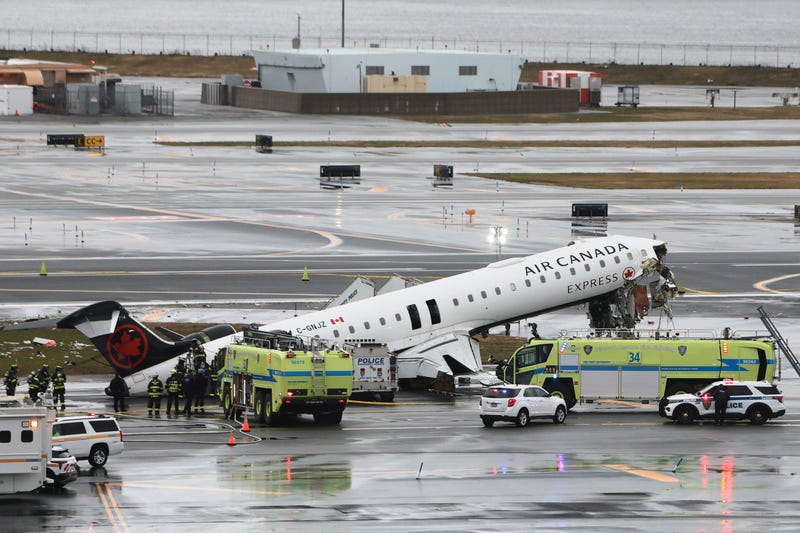 An Air Canada Express CRJ-900 sits on the runway after colliding with a Port Authority fire truck at LaGuardia Airport on March 23, 2026