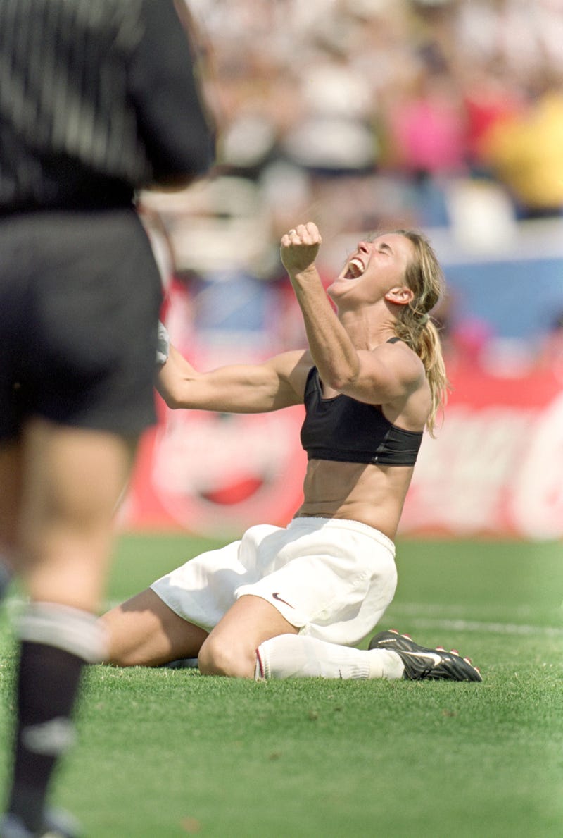 Brandi Chastain of Team USA celebrates during the Women's World Cup against Team China at The Rose Bowl on July 10, 1999 in Pasadena, California.