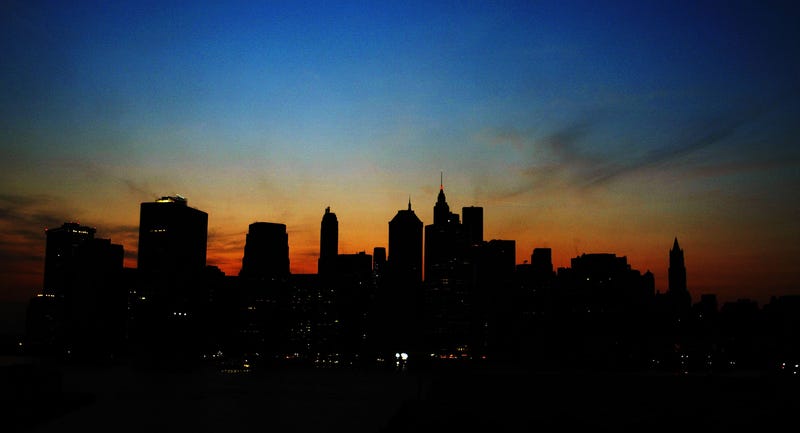 The sun sets over the Manhattan skyline on August 14, 2003, during a major power outage which affected a large part of the northeast U.S. and Canada.